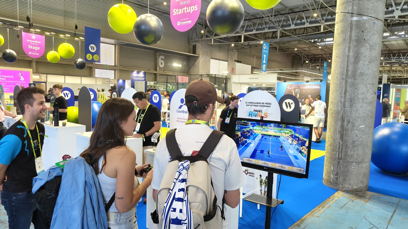 People playing the Padel Rivals demo at our stand at Padel World Summit 2026